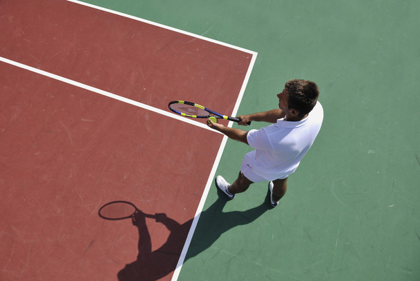 Young man play tennis outdoor - Foto, Bild