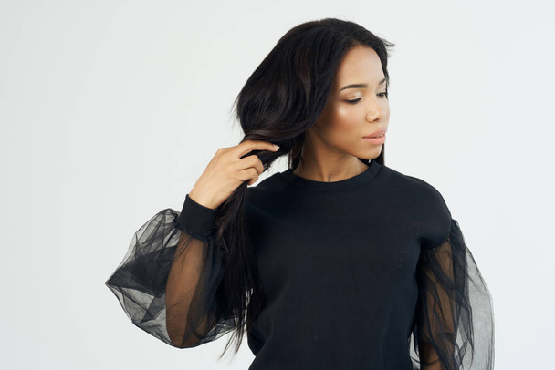 pretty woman in black shirt long hair Cosmetics face close up - Fotoğraf, Görsel