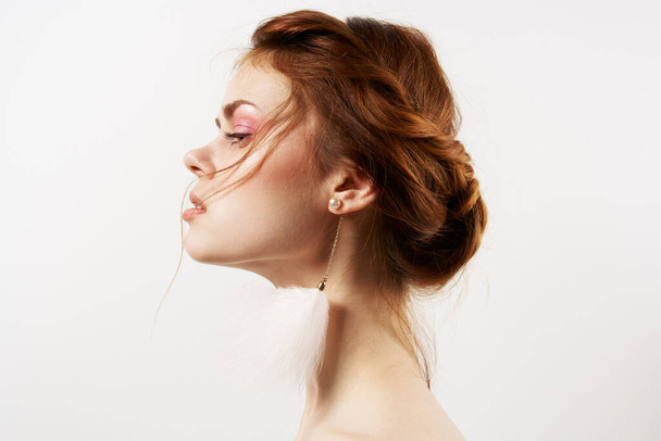attractive woman fluffy earrings jewelry bare shoulders close-up - Fotoğraf, Görsel