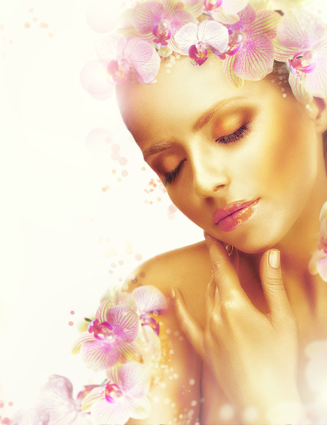 Complexion. Gorgeous Woman with Perfect Bronzed Skin and Orchid Flowers. Fragrance - Fotó, kép