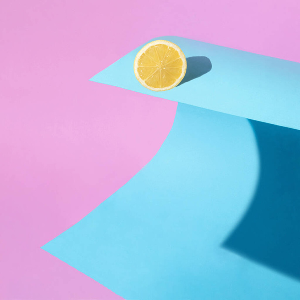 Creative composition with lemon on the wave. Minimal sea concept. Colorful summer fruit idea. - Photo, Image