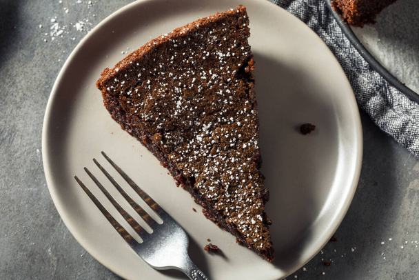 Sweet Dark Chocolate Olive Oil Cake with Powdered Sugar - Photo, image