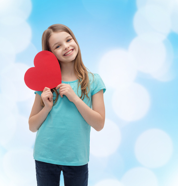 smiling little girl with red heart - Foto, Bild