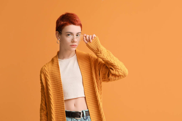 Non-binary teenager on color background - Фото, изображение