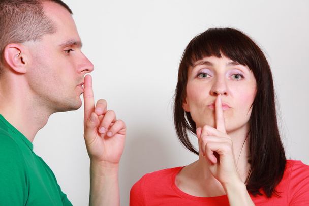 Woman and man showing hand silence sign - Photo, Image