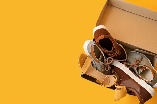 Wardrobe box with shoes on color background - Photo, Image