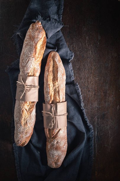 Crunchy baguettes made of whole grains. Made of wheat and rye. Pieces of baguette. - Fotó, kép