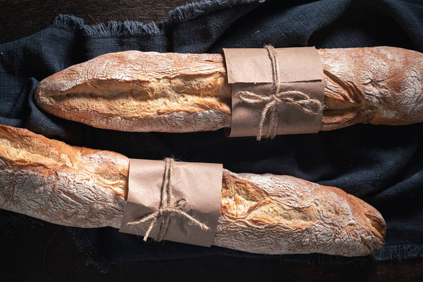 Homemade baguettes for healthy breakfast. Baguettes from the bakery. Pieces of baguette. - 写真・画像