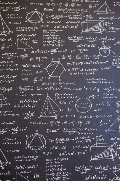 Математика на черной доске с множеством решений - вертикаль - Фото, изображение