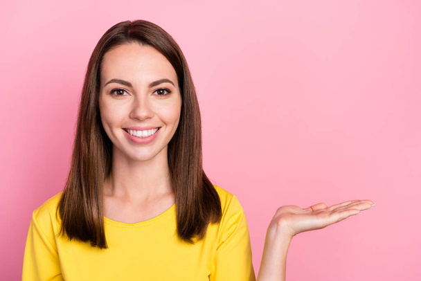 Photo of cute brunette hair millennial lady hold hand wear yellow t-shirt isolated on pink color background - Fotoğraf, Görsel