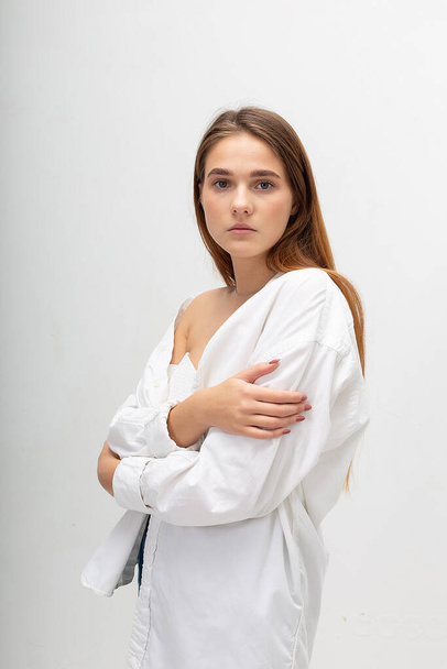 young attractive caucasian woman with long brown hair in shirt, blue jeans - Φωτογραφία, εικόνα