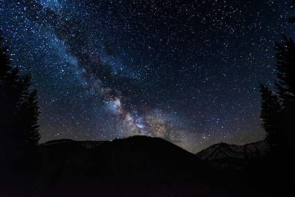Bright starry sky with the milky way on the background of High Tatras mountains - Zdjęcie, obraz