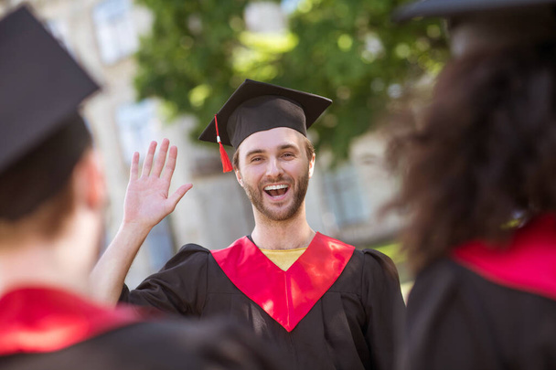Graduates from colleges feeling happy and smiling nicely - Φωτογραφία, εικόνα