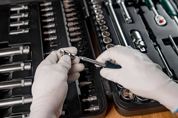Car repair tools in male hands close up - Foto, Imagem