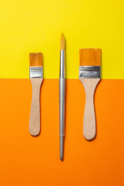 A closeup shot of different painting brushes - Fotó, kép