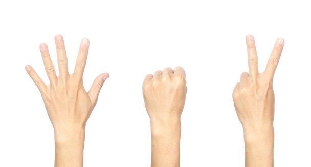 Image en gros plan du geste de la main masculine symbolisant un rocher, du papier, des ciseaux, un jeu. Isolé sur fond blanc. - Photo, image