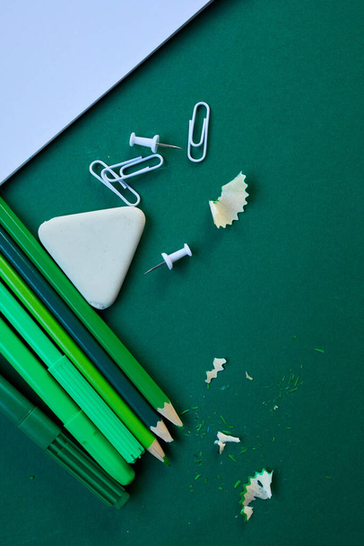 Green Flat lay Back to school concept, School and office supplies on with copy space. Lots of different stationery items on colorful background - Photo, Image