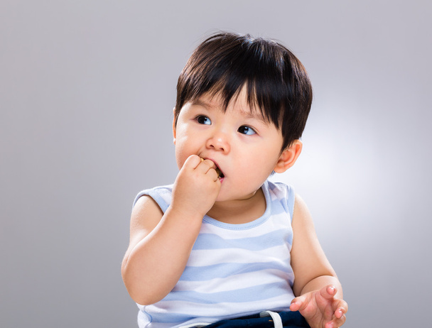 Baby boy eat cookie - Fotó, kép