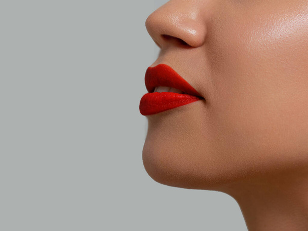 Perfect red lip makeup. Close up macro photo with beautiful female mouth. Plump full lips. Close-up face detail. Perfect clean skin, light fresh lip make-up. Beautiful spa tender lip - Fotografie, Obrázek