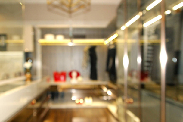 blurred wide dressing room with wardrobe in modern house as background - Fotó, kép