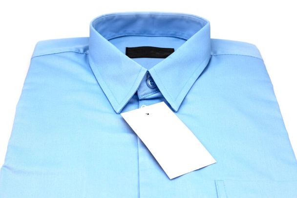 Lichtblauw shirt geïsoleerd op witte achtergrond - Foto, afbeelding