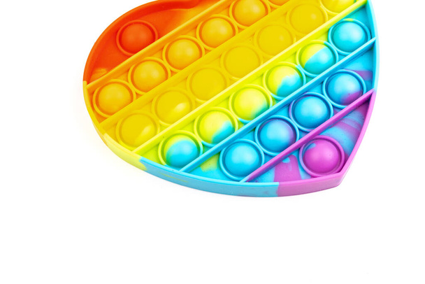 Siliconen kleurrijke anti stress pop het speelgoed. Druk op de bubbel. Eenvoudig kuiltje, close up. - Foto, afbeelding