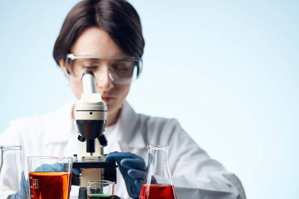 female laboratory assistant medicine research biotechnology microscope close-up - Foto, Imagem