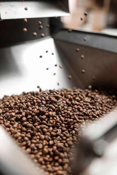 Coffee processing. Roastery, roasting machine and fresh beans - Photo, Image