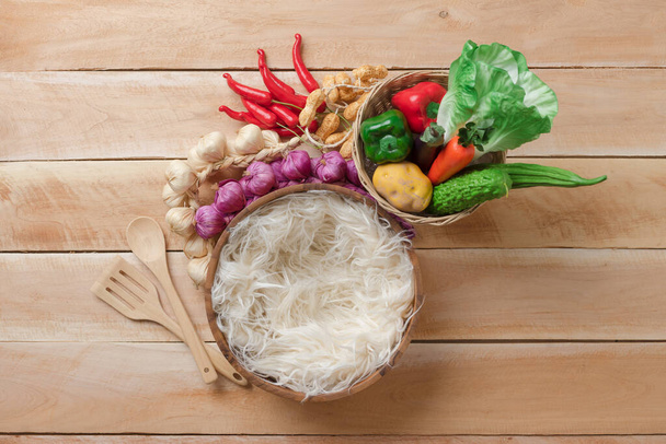 Vegetable in basket , potato , onion , garlic , pepper , carrot , peanut. - Photo, Image