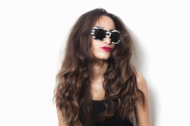 Woman with beautiful hair wearing sunglasses - Фото, зображення