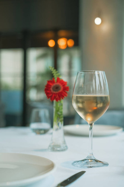a glass of wine in a restaurant  - Photo, Image