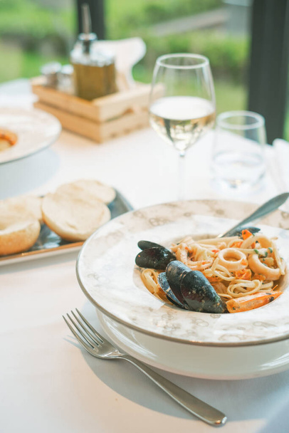 a seafood linguine in a restaurant on a table - Zdjęcie, obraz