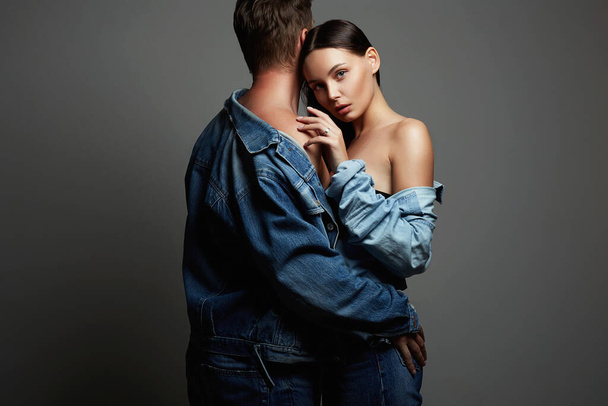 lovely beautiful couple. sexy woman and man. boy and girl together. jeans style - Foto, Bild