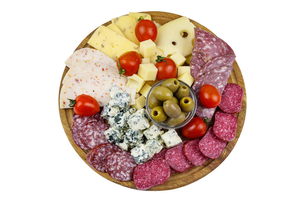 Antipasti platter with olives, cherry tomatoes, assortment of italian salami and cheese isolated on white background - Photo, Image