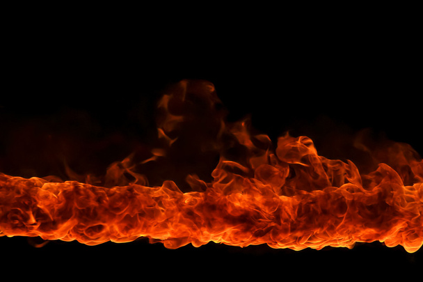Blazing flames on black background - Photo, Image