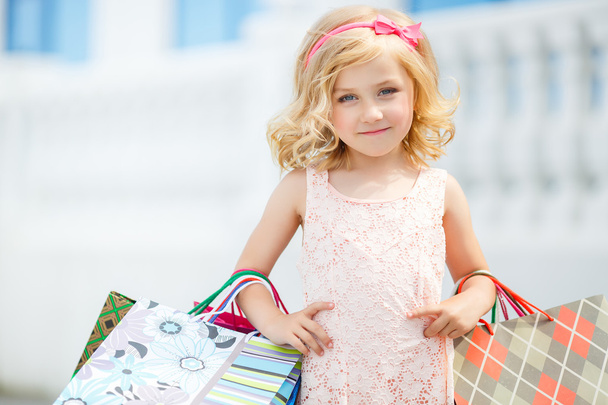 Little girl fashion with packages at the Mall. - Photo, Image