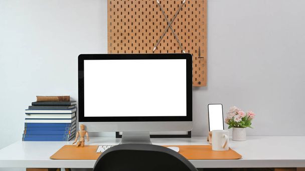 Modern workspace with computer, smart phone, and office supplies on white table. - Fotoğraf, Görsel