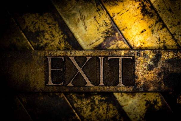 Exit text message on textured grunge copper and vintage gold background - Photo, Image