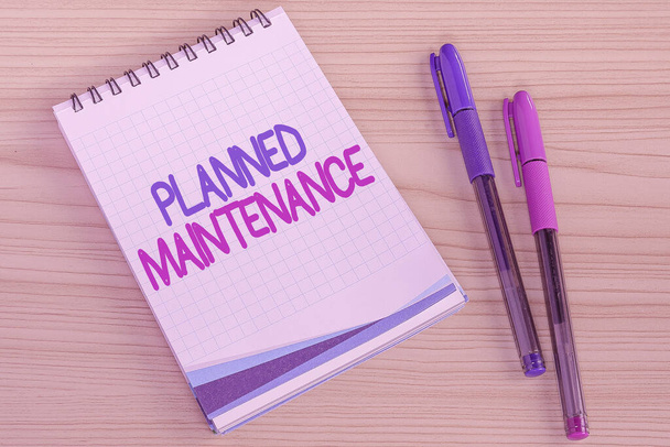 Writing displaying text Planned Maintenance. Business approach reventive maintenance carried out base on a fixed plan Multiple Assorted Collection Office Stationery Photo Placed Over Table - Foto, afbeelding