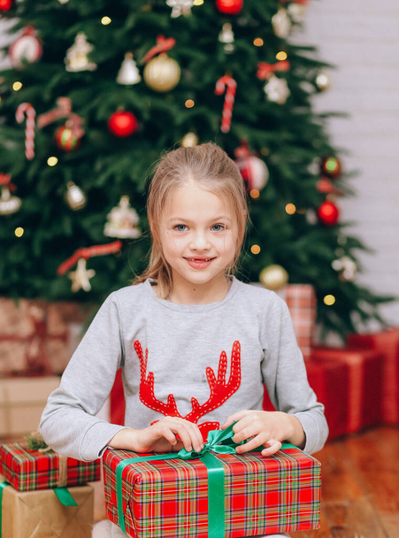 happy girls sisters with christmas gifts from santa home family holida - Фото, изображение
