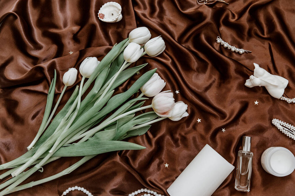Flat lay fashion collage with women accessories. Bouquet of spring white tulips .The concept of valentine's day and women's day. - Foto, Imagen