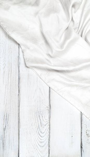 White silk fabric on white wooden background with copy space - Valokuva, kuva