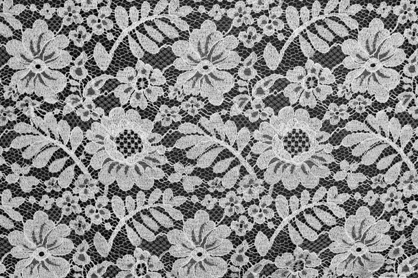 Textura floral de encaje fino blanco sobre fondo negro
 - Foto, imagen