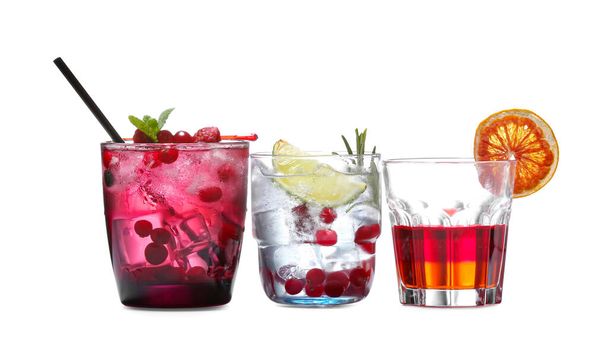 Glasses of fresh cocktails on white background - Photo, Image