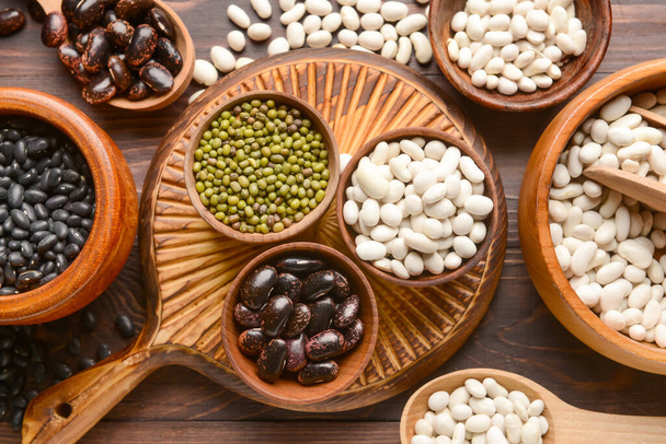 Composition with different legumes on wooden background - Photo, Image
