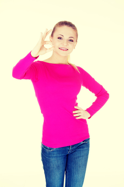 Woman showing OK gesture. - Photo, image