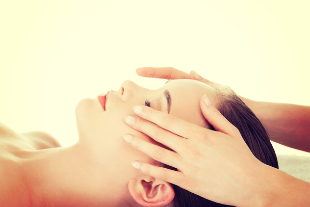 Woman receiving face massage - Фото, изображение