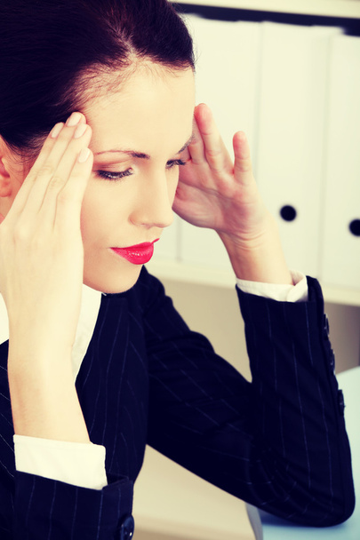 Business woman with headache. - Valokuva, kuva