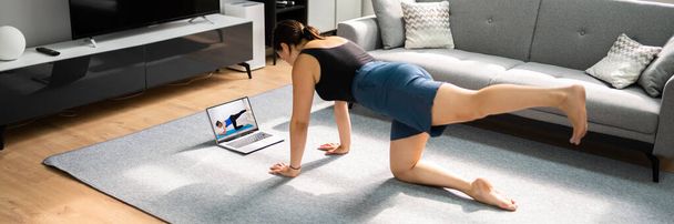 Online Yoga Workout In Living Room. Women Classes And Exercises - Φωτογραφία, εικόνα