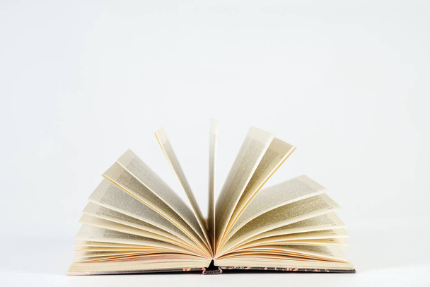 Opened book on a white background. Learning concept - Foto, Bild